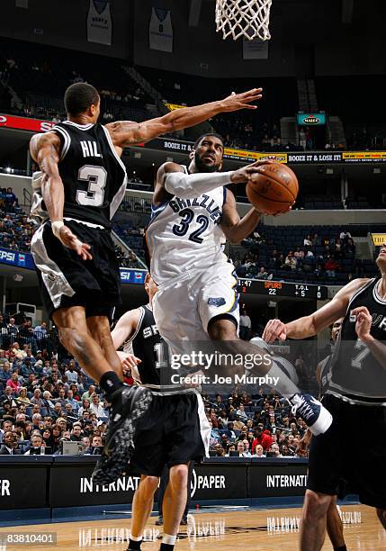 Mayo of the Memphis Grizzlies shoots a layup against George Hill of the San Antonio Spurs on November 24, 2008 at the FedExForum in Memphis,...