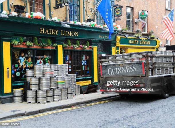 Delivery of Guinness beer barrels to traditional Hairy Lemon pub, city of Dublin, Ireland, Irish Republic.