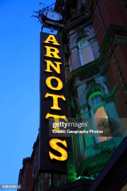 Arnotts department store shop sign at night, Dublin, Ireland, Republic of Ireland.