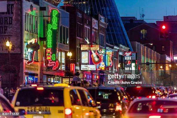 Colour lights decorate the facades of Country Music bars on Broadway in Nashville Tennessee.