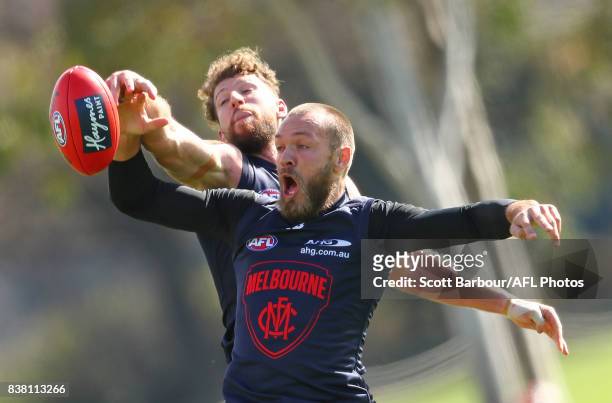 Max Gawn of the Demons and Jake Spencer of the Demons compete for the ball during a Melbourne Demons AFL training session at Gosch's Paddock on...