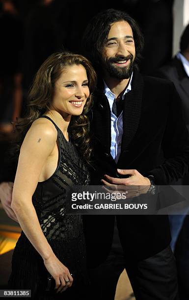 Actor Adrien Brody arrives with his girlfriend, Spanish actress Elsa Pataky, for the Los Angeles premiere of "Cadillac Records" on November 24, 2008...