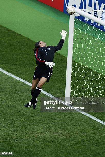 David Seaman of England is caught off his line as Ronaldinho scores Brazil's second goal during the England v Brazil World Cup Quarter Final match...