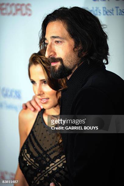 Actor Adrien Brody arrives with his girlfriend, Spanish actress Elsa Pataky, for the Los Angeles premiere of "Cadillac Records" on November 24, 2008...