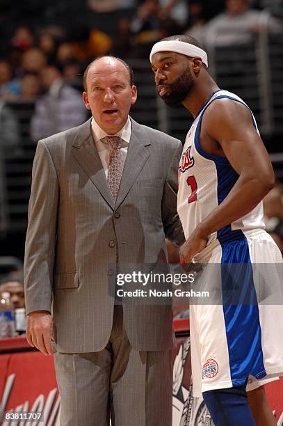 Head Coach Mike Dunleavy of the Los Angeles Clippers speaks to Baron Davis during their game against the New Orleans Hornets at Staples Center on...