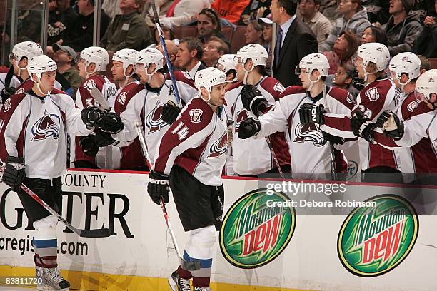 The Colorado Avalanche celebrate a third period goal from teammate Ian Laperriere against the Anaheim Ducks during the game on November 24, 2008 at...