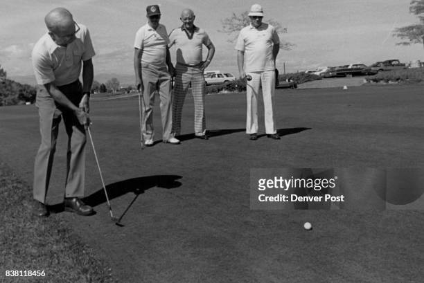 Crazy Golf' Tournament Benefits Arapahoe County Retarded Citizens Ned Koch Putts as, form left, Jack Wilson, Stan Wiruth and Tom Harding await their...