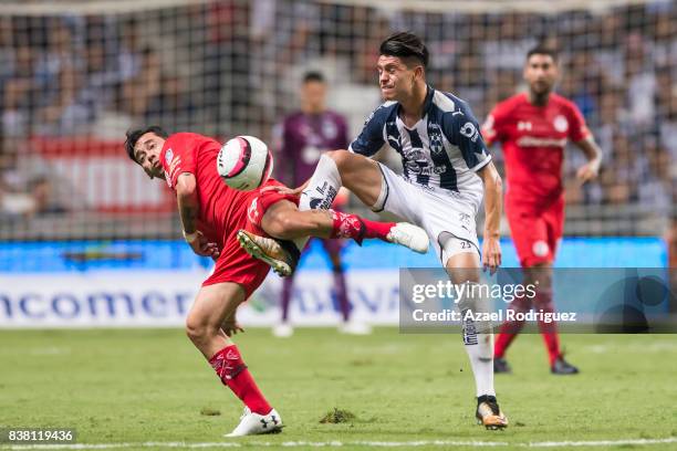 Jonathan Gonzalez of Monterrey fights for the ball with Rubens Sambueza of Toluca during the 6th round match between Monterrey and Toluca as part of...