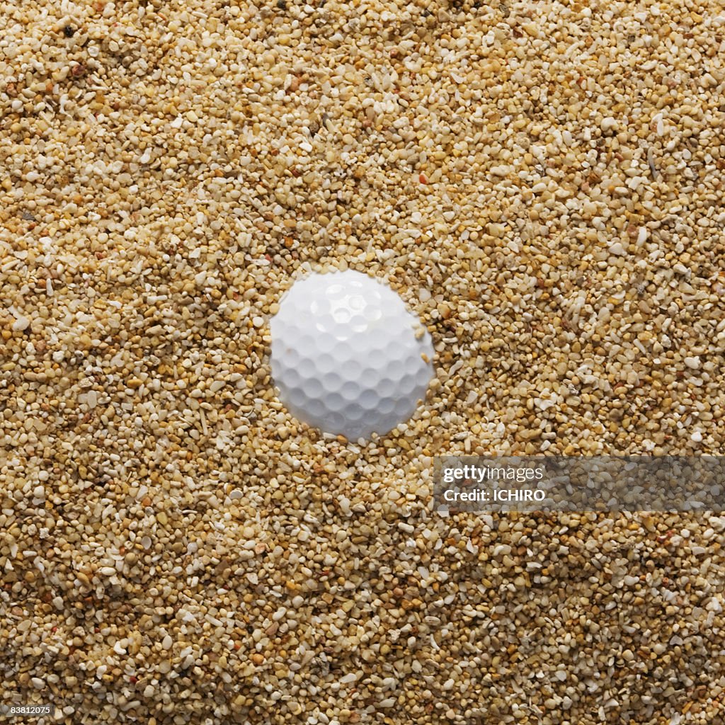 Buried golf ball.