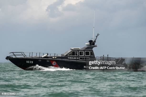 Malaysian Maritime Enforcement Agency boat takes part in the rescue operation for the missing sailors from the USS John S. McCain off the Johor coast...