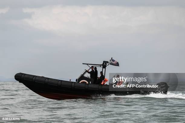 Royal Malaysia Marine Police boat takes part in the rescue operation for the missing sailors from the USS John S. McCain off the Johor coast of...