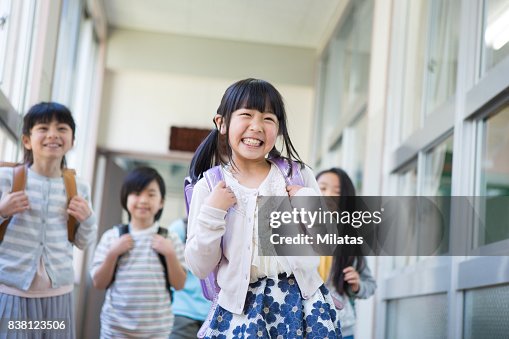 Elementary school children carrying bag Elementary school children carrying bag