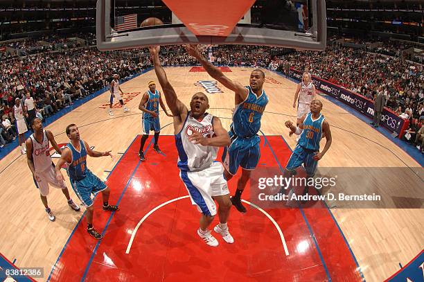 Eric Gordon of the Los Angeles Clippers goes up for a shot against Tyson Chandler of the New Orleans Hornets at Staples Center on November 24, 2008...