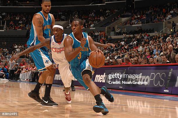 Chris Paul of the New Orleans Hornets dribbles past Mike Taylor of the Los Angeles Clippers at Staples Center on November 24, 2008 in Los Angeles,...