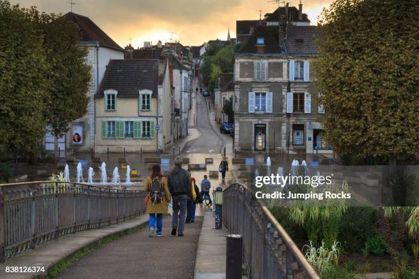 People crossing Yonne River in Auxerre, Burgundy, France.