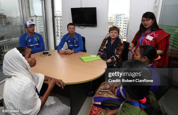 Josh Hazlewood and Jackson Bird of Australia meet local domestic workers affected by recent flooding during an Australian Test Cricket Team media...