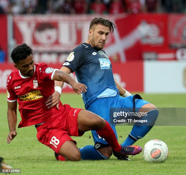 Ahmed Waseem Razeek of Erfurt and Ermin Biaki of Hoffenheim battle for the ball during the DFB Cup first round match between Rot-Weiss Erfurt and TSG...