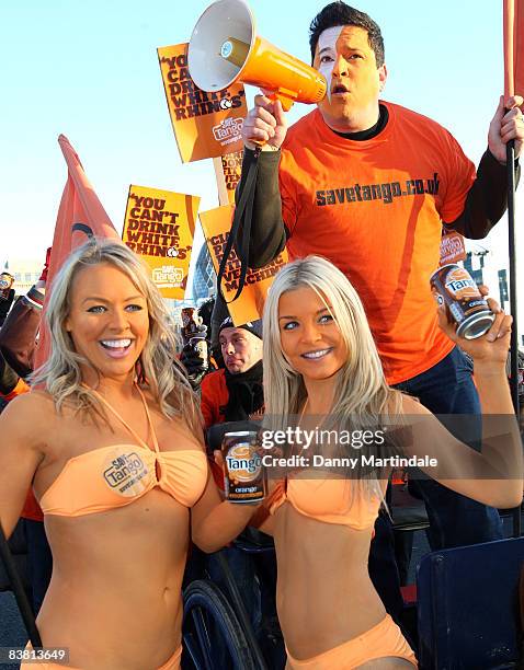 Dom Joly Promotes 'Tango' in a cart pulled by a Shetland pony, flanked by body painted orange page 3 models, and orange "umpa lumpas" by London...