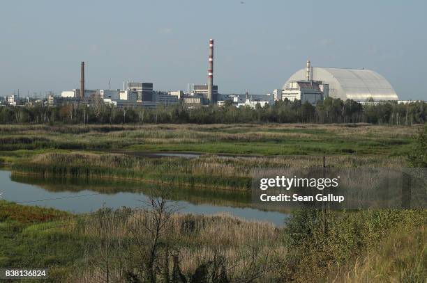 The new, giant enclosure that encases stricken reactor number four at the Chernobyl nuclear power plant is seen on August 17, 2017 near Chornobyl',...