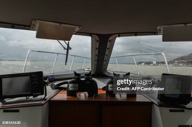 Two binoculars are seen on a Malaysian Maritime Enforcement Agency boat during the rescue operation for the missing sailors from the USS John S....