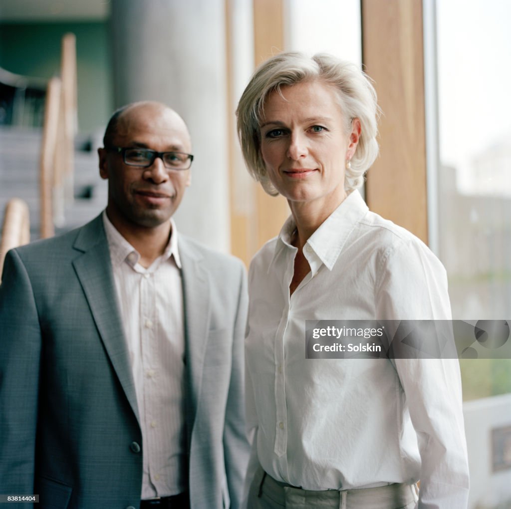 Businesswoman and man in office