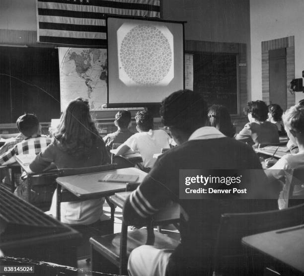 Class at Horace Mann Junior High school takes a color blindness test adopted by the Denver schools system while Mrs. Vivian Byars, school nurse, runs...