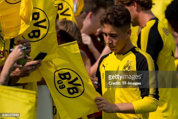 Emre Mor of Dortmund signs autographse during a training session at the BVB Training center on August 22, 2017 in Dortmund, Germany.