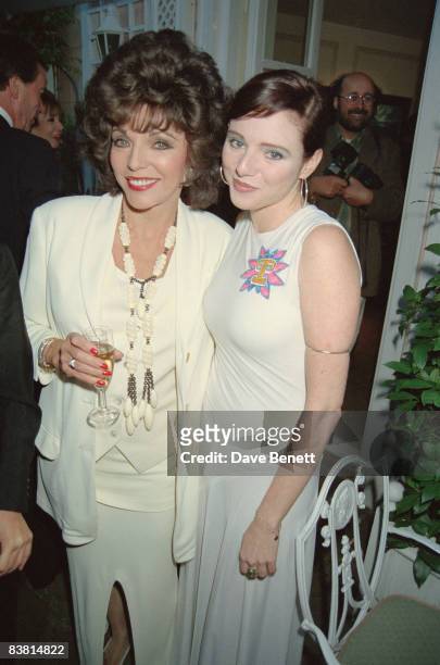 Actress Joan Collins and her daughter Tara Newley attend an exhibition by Joan's son Sacha Newley at the Halcyon Gallery in London, 9th May 1994.
