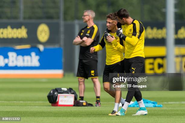 Emre Mor of Dortmund and Goalkeeper Roman Buerki of Dortmund looks on during a training session at the BVB Training center on August 22, 2017 in...