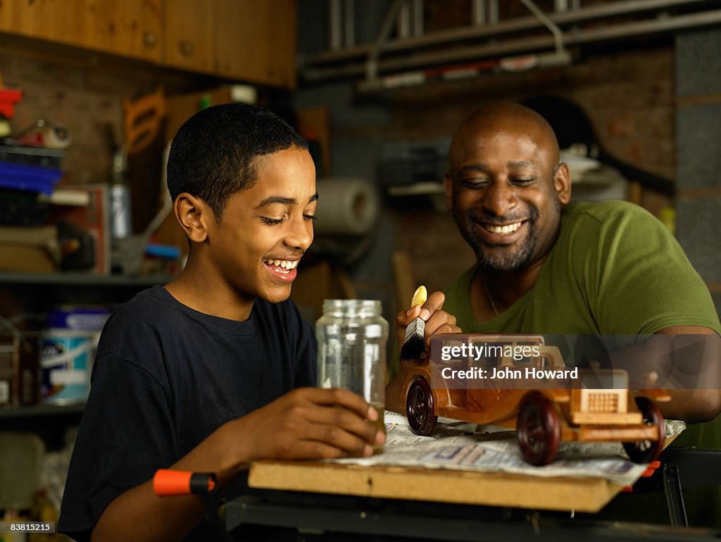 Father admiring Son's woodwork project