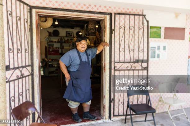 bakery owner posing with smile - inarajan stock pictures, royalty-free photos & images