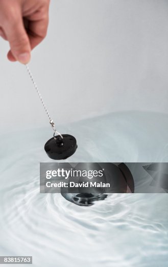 Bath plug being pulled out Bath plug being pulled out