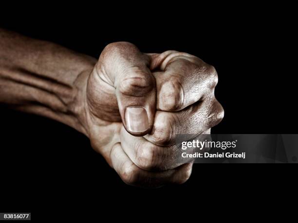 fist - raised fist stock pictures, royalty-free photos & images