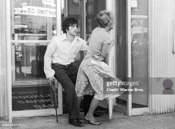 Actor Al Pacino tries to drag Penelope Allen into a bank during a robbery, in a still from the film 'Dog Day Afternoon', directed by Sidney Lumet,...