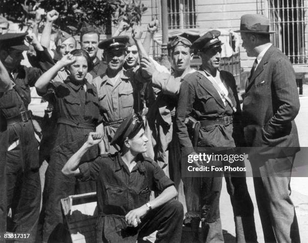 British Charge d'affairs in Madrid, Sir George Ogilvie-Forbes meets members of a republican militia group in the first months of the Spanish Civil...