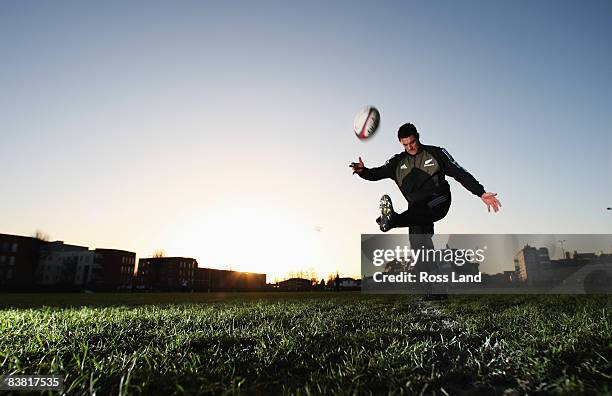 Dan Carter of the All Blacks kicks a ball during a New Zealand All Blacks training session at Latymers Upper school on November 25, 2008 in London,...