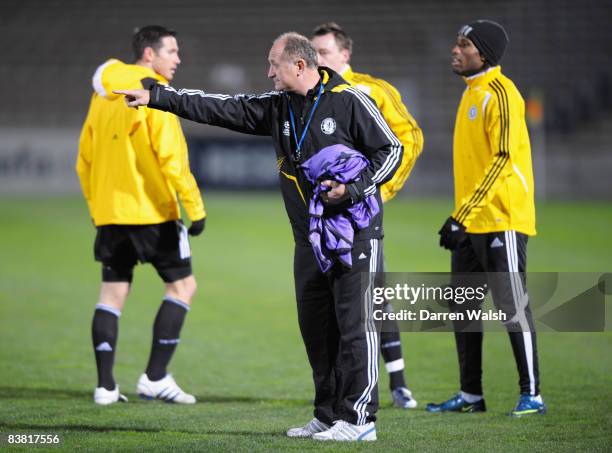 Luiz Felipe Scolari manager of Chelsea and Didier Drogba look on during a training session prior to the UEFA Champions League Group A match between...