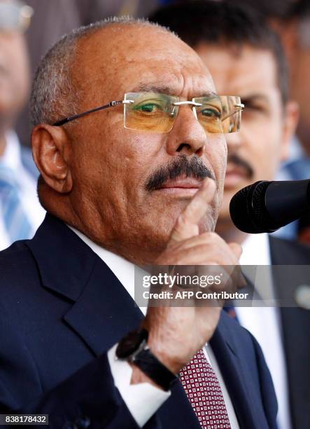 Yemen's ex-president Ali Abdullah Saleh gives a speech addressing his supporters during a rally as his political party, the General People's...