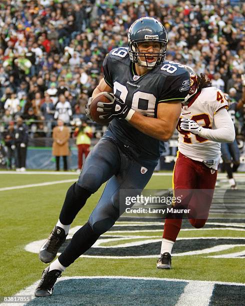 Tight end John Carlson of the Seattle Seahawks catches a pass for a touchdown in the game between the Seahawks and the Redskins at Qwest Field in...
