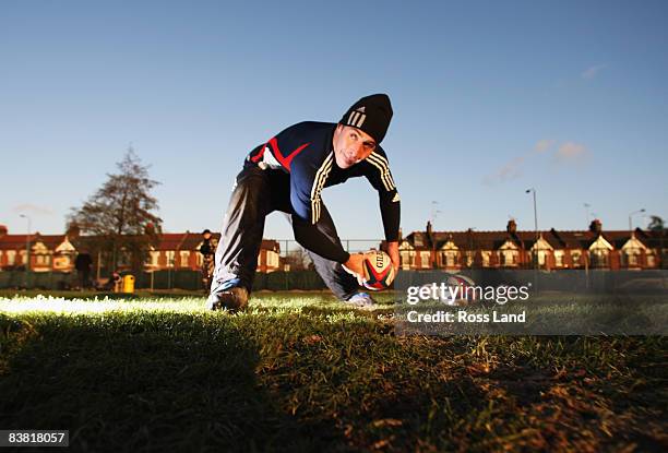 Jimmy Cowan of the All Blacks passes the ball on during a New Zealand All Blacks training session at Latymers Upper school on November 25, 2008 in...