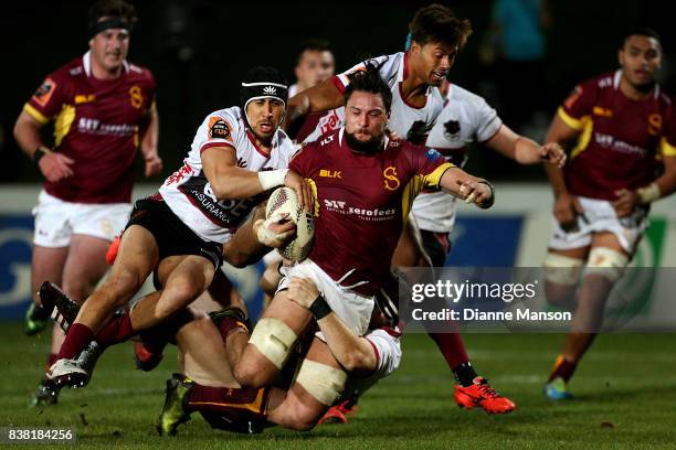 Elliot Dixon of Southland is Tackled by Chris Smylie of North Harbour during the Mitre 10 Cup match between Southland and North Harbour at Rugby Park...