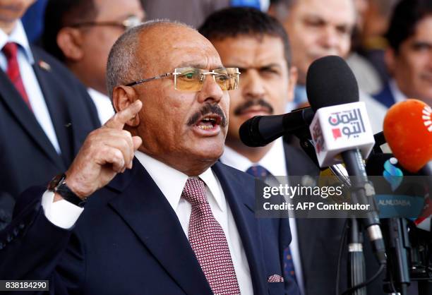 Yemen's ex-president Ali Abdullah Saleh gives a speech addressing his supporters during a rally as his General People's Congress party, marks 35...