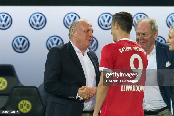 Uli Hoeness of Bayern Muenchen shakes hands with Robert Lewandowski of Bayern Muenchen during the DFL Supercup 2017 match between Borussia Dortmund...