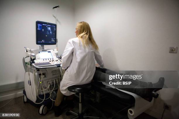 Radiology center, France, radiologist carries out a pelvic scan.