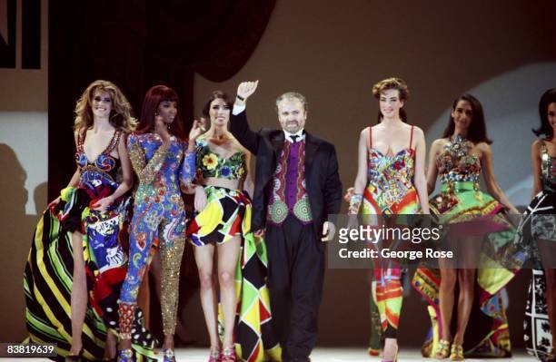 Italian designer and toast of Paris, Miami and New York, Gianni Versace, takes a bow at a 1991 Los Angeles, California, fashion show.