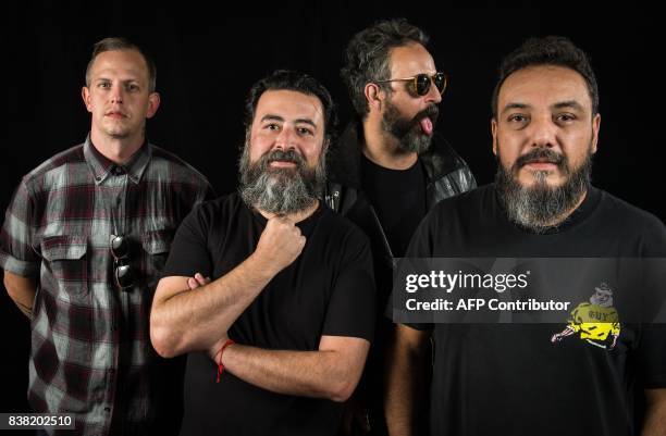 Randy Ebright, Micky Huidobro, Tito Fuentes and Paco Ayala, members of the Mexican rock band Molotov, pose during a photo shoot in Mexico City on...