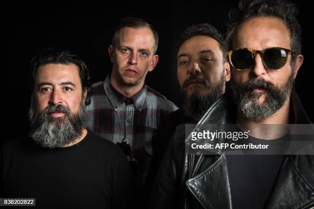 Micky Huidobro, Randy Ebright, Paco Ayala and Tito Fuentes, members of the Mexican rock band Molotov, pose during a photo shoot in Mexico City on...