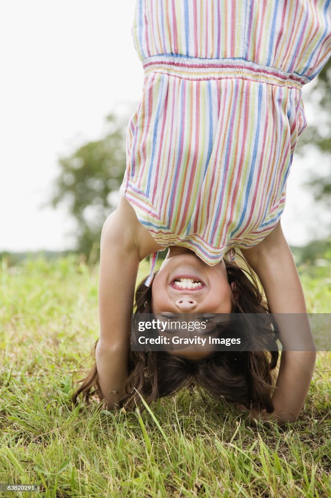 Young Girl Doing a Hand Stand