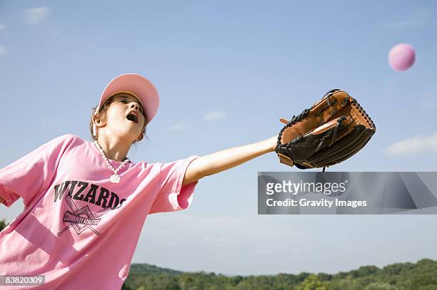 young girl playing softball - basebollhandske bildbanksfoton och bilder