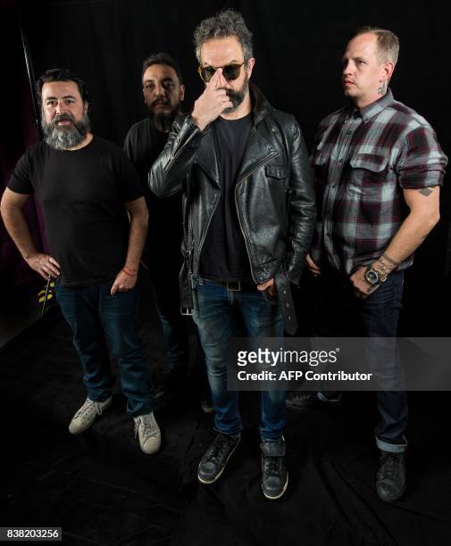 Micky Huidobro, Paco Ayala, Tito Fuentes and Randy Ebright, members of the Mexican rock band Molotov, pose during a photo shoot in Mexico City on...